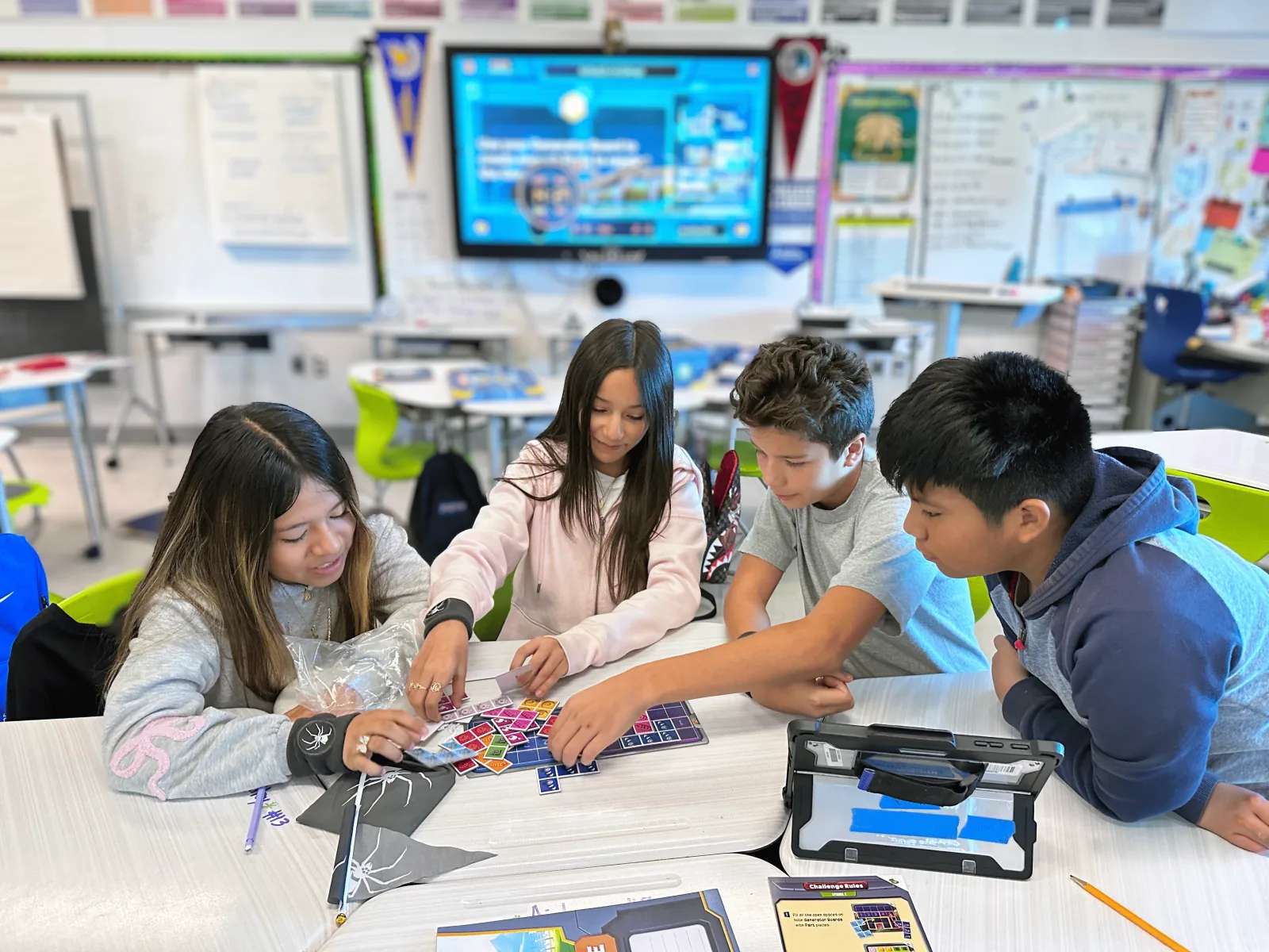 Students working together at a classroom desk